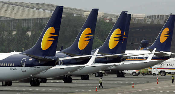 Jet Airways aircraft stand on tarmac at the domestic airport terminal in Mumbai.