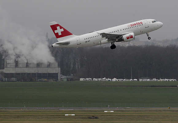 A Swiss airlines plane takes off at Cointrin airport in Geneva, Swizerland.