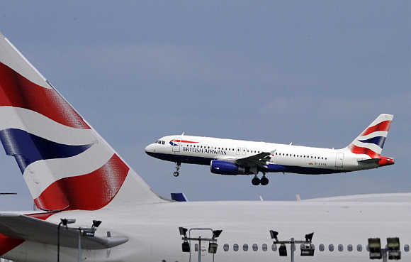 A British Airways plane lands at Heathrow Airport in west London.