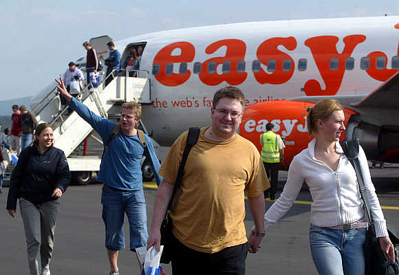 Passengers disembark from easyJet's plane at Ljubljana's airport in Slovenia.