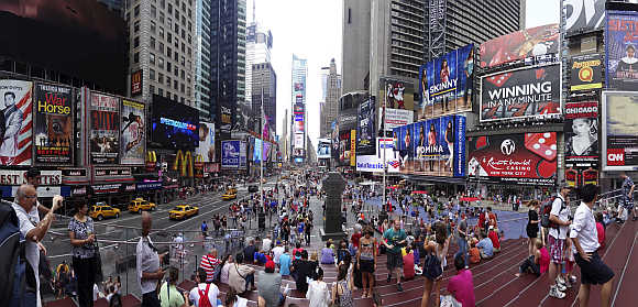 Tourists gather in Times Square, New York.