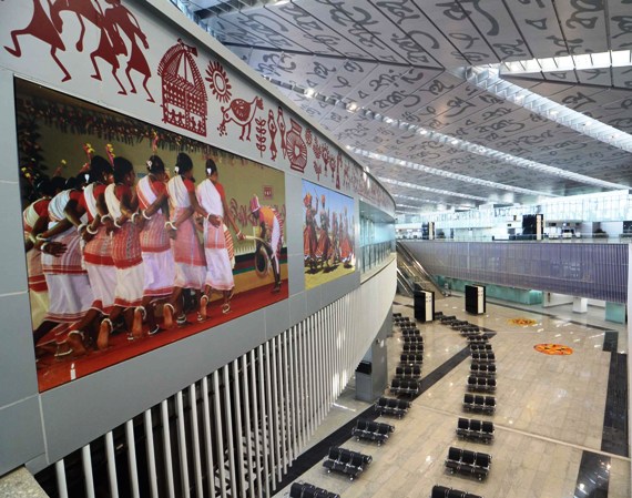 The new Kolkata airport. While the walls are beautified with photographs of traditional folk dances of Bengal, the roof carries lines from Tagore's works.