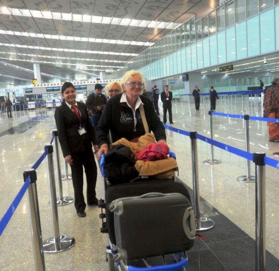 Foreigners check in their luggages at the new Kolkata airport.