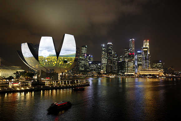 Garden of Light, an animation by Hexogon Solution of Singapore, is projected on the ArtScience Museum during a media preview of the i Light Marina Bay sustainable light art festival in Singapore.