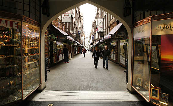 Shoppers stroll through a central Perth arcade.
