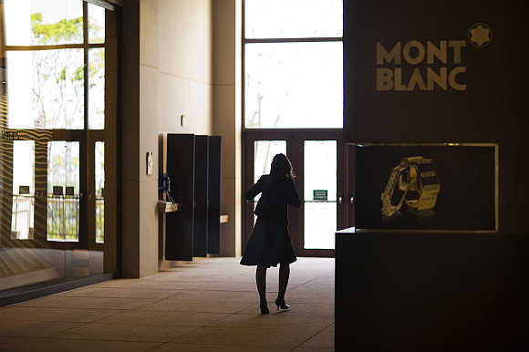 A woman walks next to a Mont Blanc store at Oscar Freire street, Sao Paulo's version of Rodeo Drive in Beverly Hills.