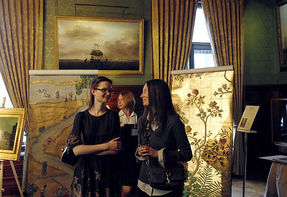 Antique dealers display a selection during a presentation at the British ambassador's residence in Moscow.
