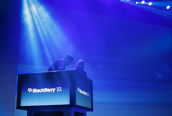 Workers prepare the stage ahead of the launch of BlackBerry 10 devices in New York.
