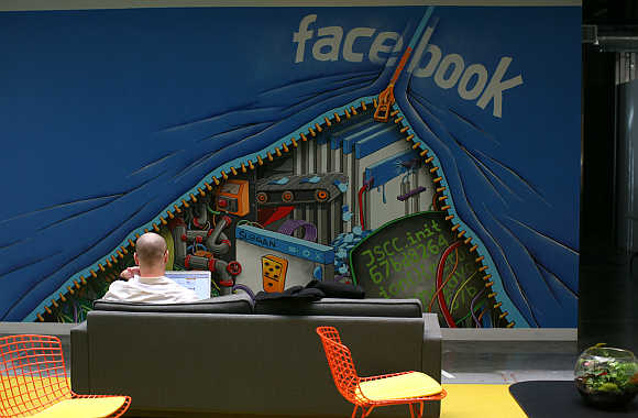 An employee works on a computer at the headquarters of Facebook in Menlo Park, California.