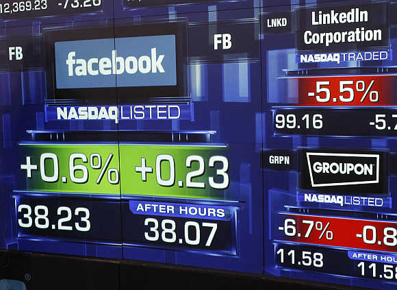 Monitors show the value of the Facebook at the Nasdaq Marketsite in New York.