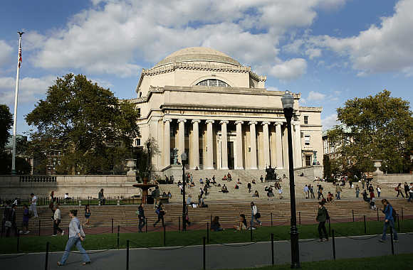 Students walk across the campus of Columbia University in New York.