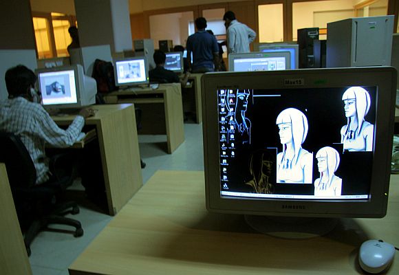 Indian animation designers work on a production floor.
