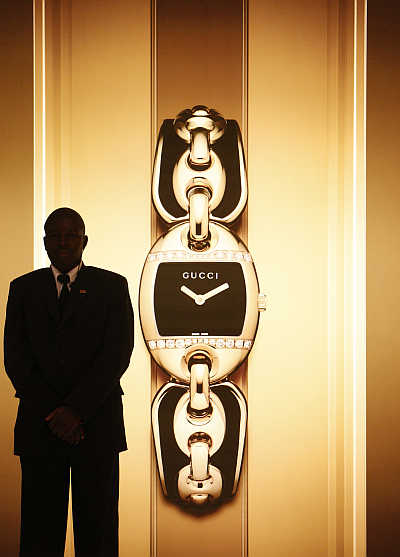 A security guard stands at the Gucci showcase at the opening of the Baselworld in Basel, Switzerland.