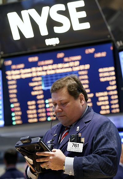 A trader works on the floor at the New York Stock Exchange.