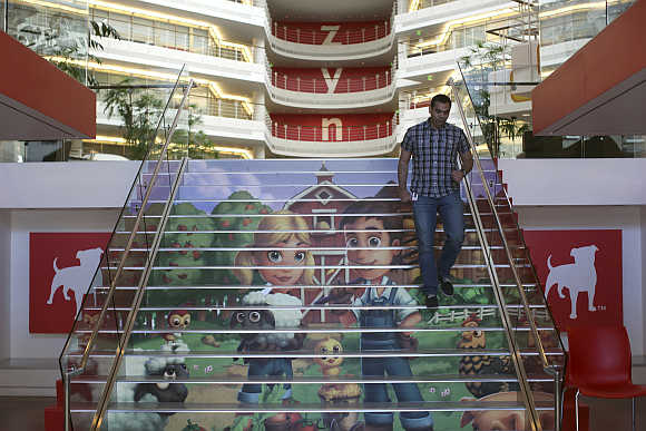 Player avatars from Zynga's FarmVille 2 are seen on a stairway at the entrance to Zynga headquarters in San Francisco, California.