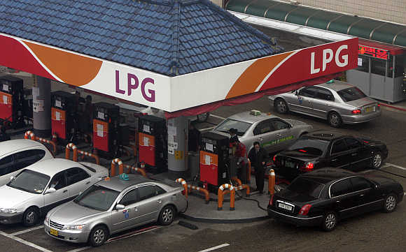 Vehicles fill up gas at a SK Energy's liquefied petroleum station in Seoul, South Korea.