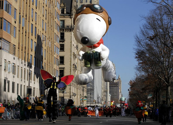 Snoopy the Flying Ace balloon floats down Central Park West during the 85th Macy's Thanksgiving Day parade in New York City.