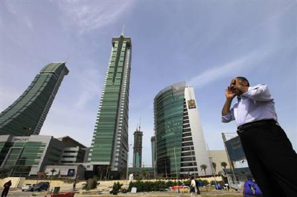 A person is seen standing at the junction of Bahrain Financial Harbour in Manama.