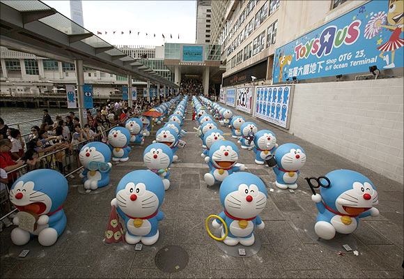 A gang of 100 different Doraemon figures are lined up in neat rows at HarbourCity in Hong Kong.