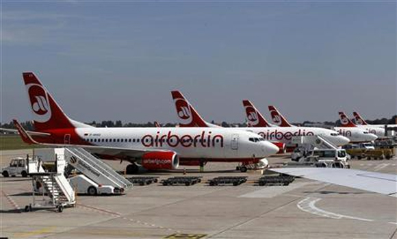 Air Berlin aircrafts stand on the tarmac at Berlin Tegel airport.
