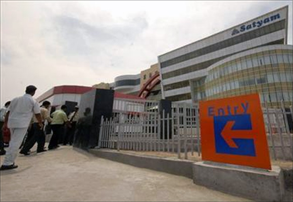 Employees of Satyam Computer Services, enter their head office in the southern Indian city of Hyderabad.