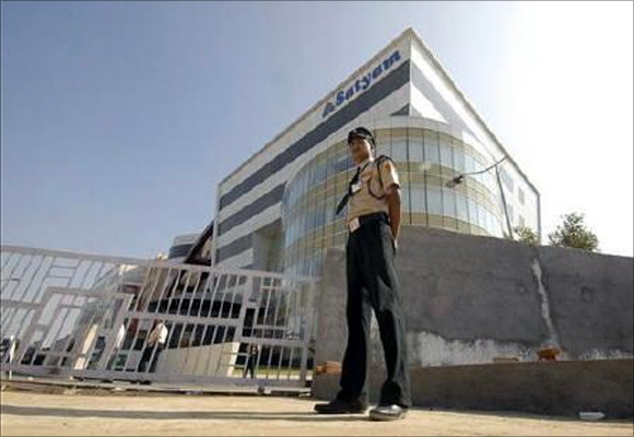 A security guard stands outside the head office of Satyam Computer Services in Hyderabad.