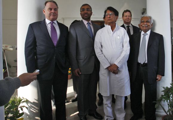 James Hogan (L), chief executive of Abu Dhabi's Etihad Airways, Ahmad Ali-al-Sayegh (2nd L), a board member of Etihad Airways, India's Civil Aviation Minister Ajit Singh (C) and Naresh Goyal (R), Chairman of Jet Airways.