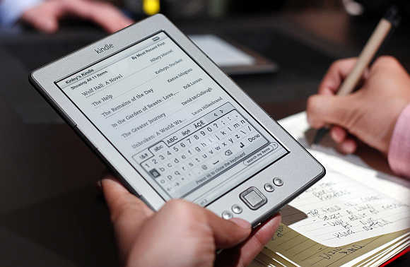 A reporter tries out a Kindle tablet in New York.