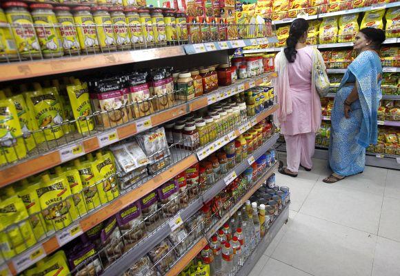 Customers shop at a retail store.