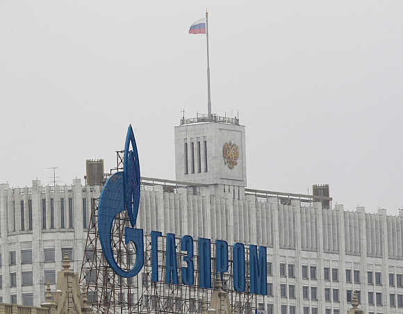 Gazprom logo on an advertisement in front of the White House in Moscow.