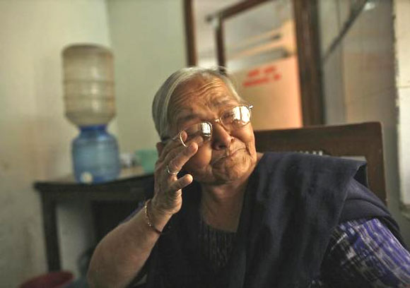 Kamla Devi, 55, an employee who has served for 30 years, cries as she talks about her career, inside the Central Telegraph Office in New Delhi July 10, 2013.