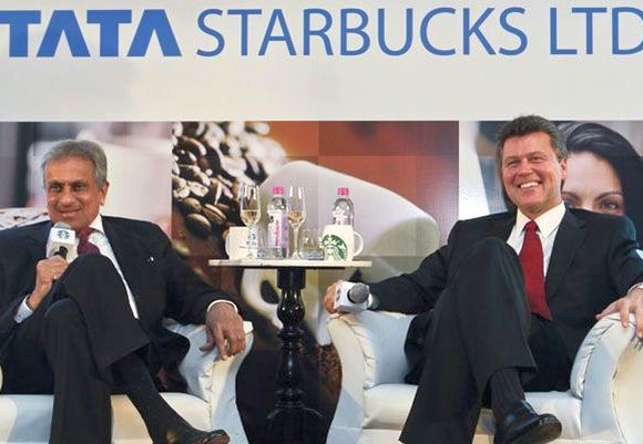 Vice Chairman of Tata Global Beverages R.K. Krishna Kumar and President of Starbucks China and Asia Pacific John Culver (R).