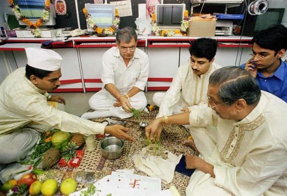 Brokers perform a traditional prayer ritual on the occasion of Diwali in Mumbai, November 7.