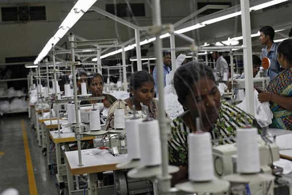 Employees sew clothes at the Estee garment factory in Tirupur, Tamil Nadu. With knitwear exports of over $2 billion a year, India's garment manufacturing hub Tirupur has earned the nickname 'Dollar City'.