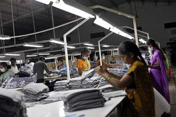 Employees sort clothes before packing them at the Estee garment factory in Tirupur, Tamil Nadu.