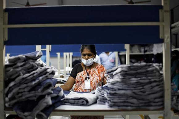 An employee sorts pieces of cloth at the Estee garment factory in Tirupur, Tamil Nadu.