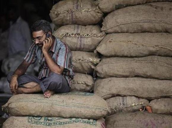 A trader talks on his phone.