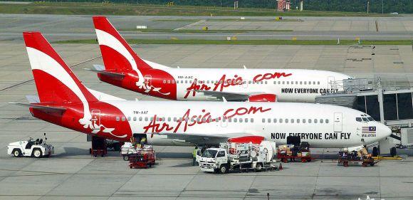 Malaysian AirAsia aircrafts park at Kuala Lumpur International Airport.