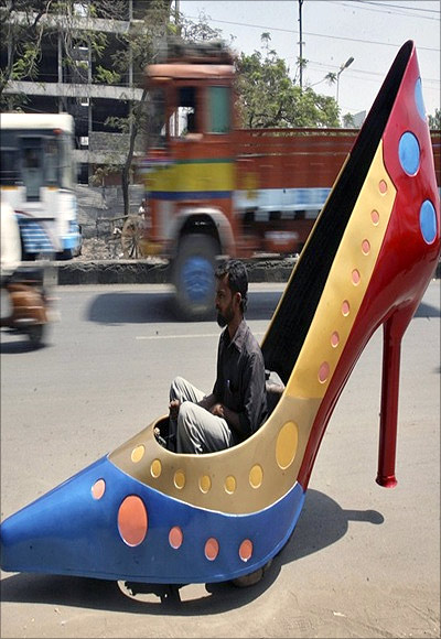 A car in the shape of a high-heel shoe gets a road test in Hyderabad.
