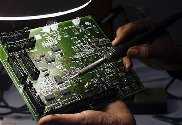 A semiconductor chip designer works on a computer component in Bangalore.