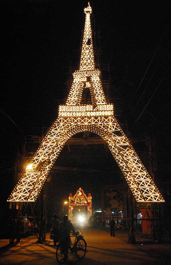 A Durga Puja pandal, built in the shape of Eiffel Tower of Paris, is illuminated in Ranchi.