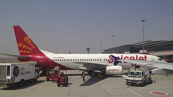 A SpiceJet Boeing 737-800 aircraft is parked at Hyderabad airport.