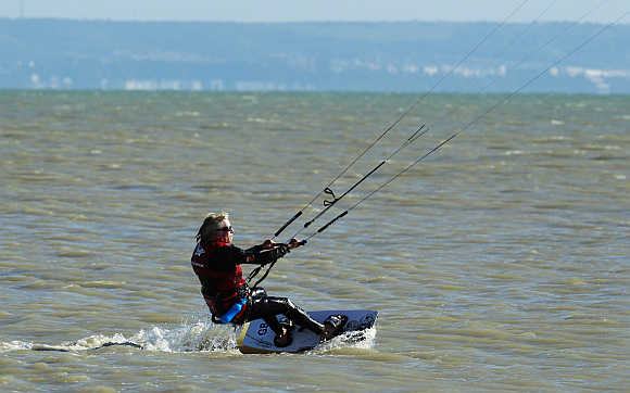 Richard Branson kitesurfs to test conditions in the English Channel at Dungeness, in south east England.