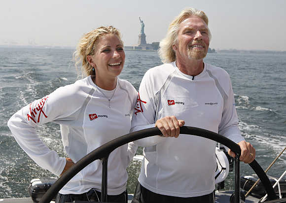 Richard Branson and his daughter Holly sail on the boat 'Virgin Money', as it goes out for a sea trial in New York harbor near the Statue of Liberty.