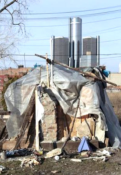A makeshift homeless people's structure is seen with the General Motors world headquarters in the background in Detroit.