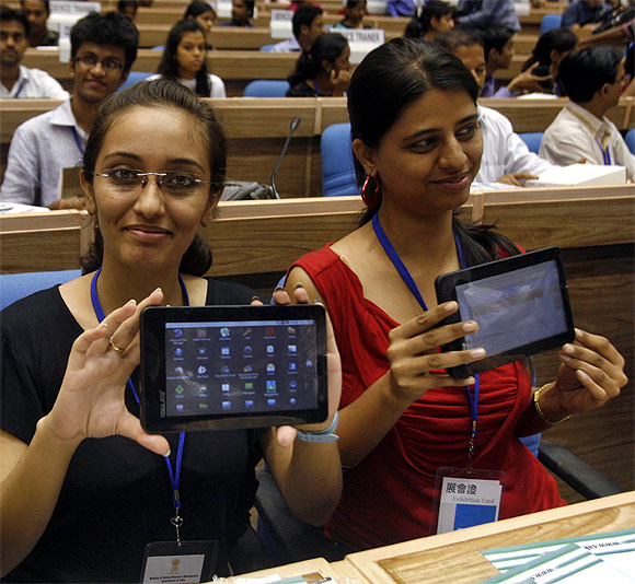 Students with Aakash tablets.