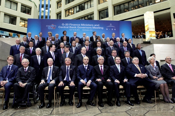 IMF Managing Director Christine Lagarde (2nd R) joins finance ministers and central bank governors from the G20 as they pose for a family photo during the 2013 Spring Meeting of the International Monetary Fund and World Bank in Washington, April 19, 2013.