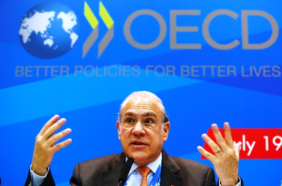 Angel Gurria, secretary-general of the Organisation for Economic Co-operation and Development (OECD), gestures during a news conference, part of the G20 finance ministers and central bank governors' meeting, in Moscow, July 19, 2013.