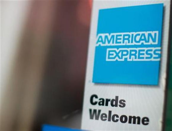 An American Express sign is seen on a restaurant door in New York.