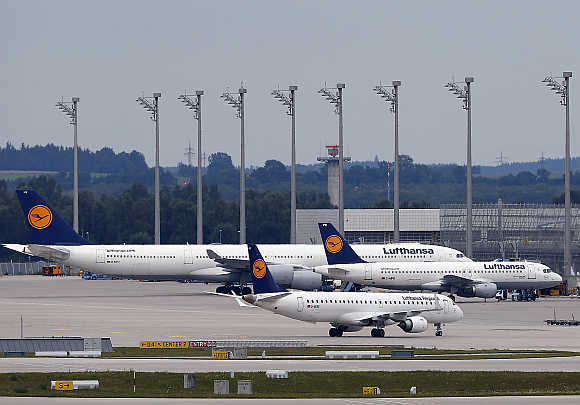 Lufthansa planes stand on the tarmac at Munich's international airport in Germany.